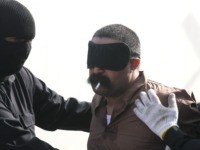 A Saudi man smokes his last cigarette before being hanged for the murder of a compatriot just west of the capital Kuwait City, on April 1,2013. Authorities in Kuwait hanged three convicted murderers, a Pakistani, a Saudi and a stateless Arab, in the first executions in the Gulf state since …