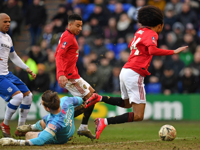 Manchester United's Dutch midfielder Tahith Chong (R) is fouled by Tranmere Rovers' Englis