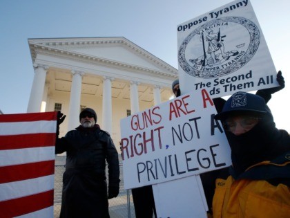 Gun-rights supporters demonstrate in front of state Capitol in Richmond, Va., Monday morning Jan. 20, 2020. Gun-rights activists and other groups are descending on Virginiaâ€™s capital city of Richmond to protest plans by the state's Democratic leadership to pass gun-control legislation. (AP Photo/Steve Helber)