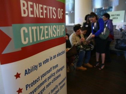NEW YORK, NY - MARCH 12: A volunteer (R), assists immigrants with U.S. citizenship applications at a Citizenship Now! event held by the City University of New York (CUNY), on March 12, 2016 in the Bronx borough of New York City. Many immigrants are rushing to process their citizenship applications …