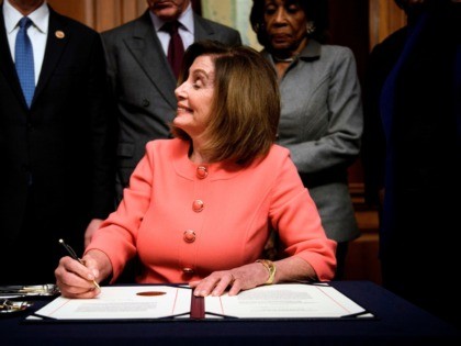 US Speaker of the House Nancy Pelosi signs the Articles of Impeachment against US President Donald Trump at the Rayburn Room on Capitol Hill January 15, 2020, in Washington, DC. - The US House of Representatives voted Wednesday to transmit articles of impeachment against President Donald Trump to the Senate, …