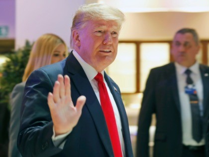 U.S. President Donald Trump waves as he arrives at the World Economic Forum in Davos, Switzerland, Wednesday, Jan. 22, 2020. The 50th annual meeting of the forum is taking place in Davos from Jan. 21 until Jan. 24, 2020. (AP Photo/Markus Schreiber)