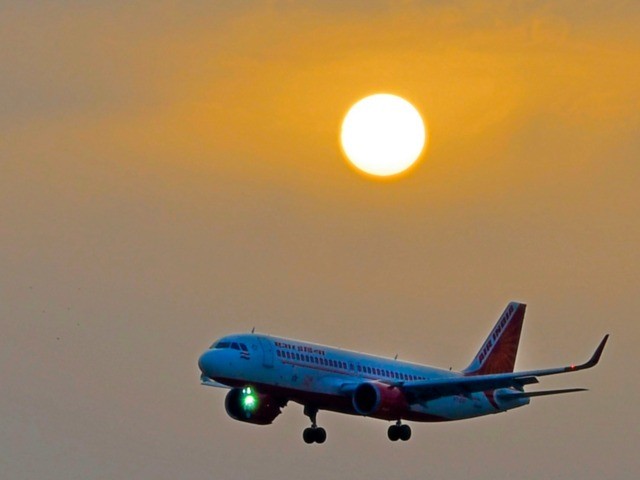 The Air India plane flying the inaugural trip from Lucknow, the capital of India's Uttar Pradesh, approaches to land at Najaf International Airport in the central Iraqi shrine city on February 14, 2019. - Lucknow, the capital of India's Uttar Pradesh, has a large population of Shiite Muslims. The holy …