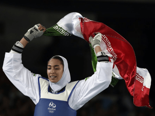 In this Aug. 18, 2016 file photo, Kimia Alizadeh Zenoorin of Iran celebrates after winning the bronze medal in a women's Taekwondo 57-kg competition at the 2016 Summer Olympics in Rio de Janeiro, Brazil. Zenoorin, Iran's only female Olympic medalist, said she defected from the Islamic Republic in a blistering …