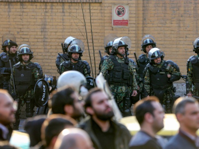 Iranian security forces stand guard in front of the British embassy in the capital Tehran