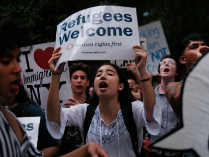 Hundreds of people gather in front of U.S. Senator Chuck Schumer's Brooklyn apartment to protest the migrant detention facilities on July 02, 2019 in New York City. Across the country tens of thousands of people are gathering for "Close the Camps' protests to voice their anger at the Trump administration's …