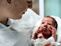 A woman holds her premature baby in the neonatal ward of the Centre Hospitalier de Lens in Lens, northern France on December 4, 2013. AFP PHOTO / PHILIPPE HUGUEN / AFP PHOTO / Philippe HUGUEN (Photo credit should read PHILIPPE HUGUEN/AFP via Getty Images)