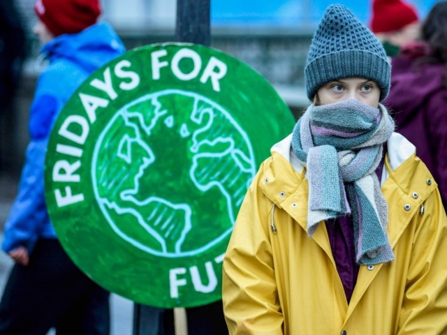 Swedish environmental activist Greta Thunberg attends a climate strike arrangd by the orgatisation "Fridays For Future" outside the Swedish parliament Riksdagen in Stockholm, December 20, 2019. (Photo by Pontus LUNDAHL / TT News Agency / AFP) / Sweden OUT (Photo by PONTUS LUNDAHL/TT News Agency/AFP via Getty Images)