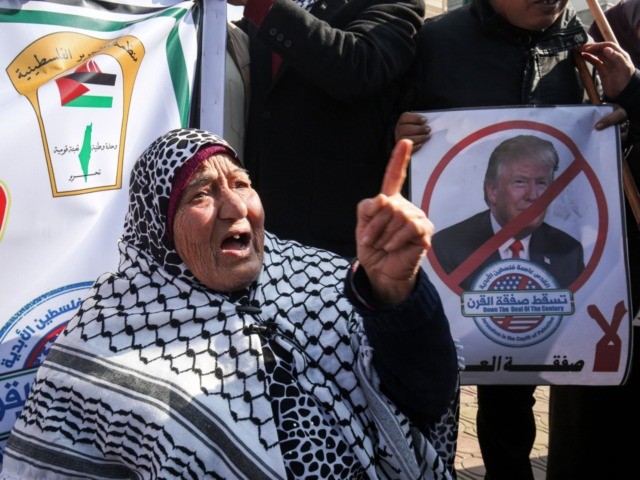 Palestinian demonstrators chant slogans against US President Donald Trump during a protest against his expected announcement of a peace plan, in Rafah in the southern Gaza strip on January 28, 2020. (Photo by SAID KHATIB / AFP) (Photo by SAID KHATIB/AFP via Getty Images)