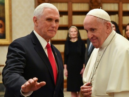 Pope Francis (R) speaks with the US Vice President Mike Pence (L) during a private audienc