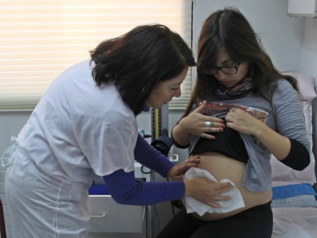 Rayen Luna Solar, 27, 33-week pregnant, is seen by her midwife in a routine checkup, in Sa