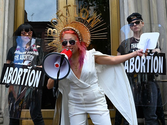 Viva Ruiz from "Thank God For Abortion" takes part in an abortion rights rally in front of the Middle Collegiate Church in the East Village of New York on May 21, 2019. - Demonstrations were planned across the US on Tuesday in defense of abortion rights, which activists see as …