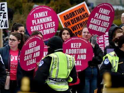 Pro-choice and pro-life activists demonstrate in front of the the US Supreme Court during
