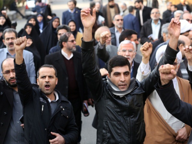 Supporters of the Basij, a militia loyal to the Islamic republic's establishment, chant an
