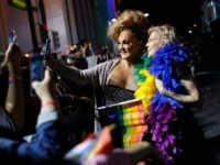 Democratic presidential candidate Sen. Elizabeth Warren, D-Mass., right, poses for a selfie at the Las Vegas Pride Parade, Friday, Oct. 11, 2019, in Las Vegas. (AP Photo/John Locher)