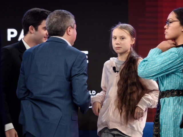 Swedish climate activist Greta Thunberg (C) and Canadian climate and environmental activis