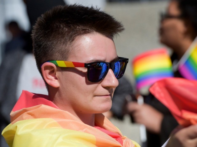 A picture taken on October 10, 2017 shows Lend Mustafa a transgender man marching on Kosovo's first pride parade in Pristina. - "After being the main speaker at last year's pride parade I personally received hundreds of threats from religious extremists, including life threatening ones," he told AFP.espite a high …