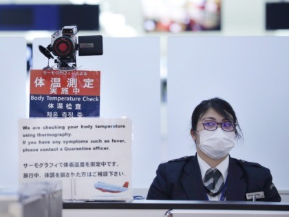 OPSHOT - In this picture taken on January 16, 2020, officers work at a health screening station as they observe passengers arriving on a flight from Wuhan, China, where a SARS-like virus was discovered and has since spread, at Narita airport. - The death toll from a new China virus …