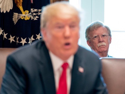 National security adviser John Bolton listens as President Donald Trump speaks during a ca