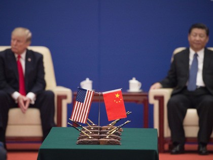 US President Donald Trump (L) and China's President Xi Jinping attend a business lead
