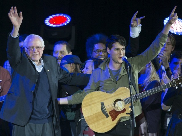 Democratic presidential candidate Sen. Bernie Sanders, I-Vt., left, and Vampire Weekend le