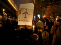 People gather for a candlelight vigil to remember the victims of the Ukraine plane crash, at the gate of Amri Kabir University that some of the victims of the crash were former students of, in Tehran, Iran, Saturday, Jan. 11, 2020. Iran on Saturday, Jan. 11, acknowledged that its armed …