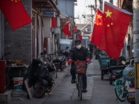 viral BEIJING, CHINA - JANUARY 31: A Chinese man wears a protective mask as he rides his bike in an alley on January 31, 2020 in Beijing, China. The number of cases of a deadly new coronavirus rose to almost 9700 in mainland China Friday, the day after the World …