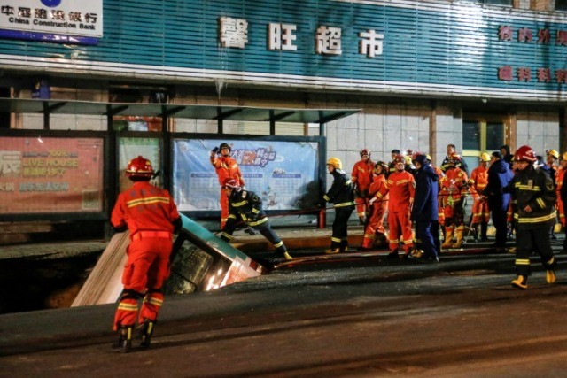 Huge sinkhole swallows bus, kills nine in China