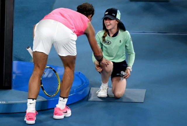 Nadal shows caring side with kiss for blushing ballgirl