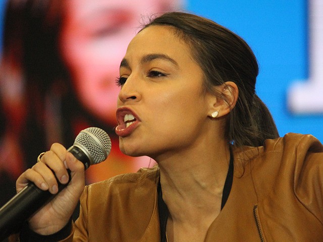 Rep. Alexandria Ocasio-Cortez speaking to attendees at a rally for Bernie Sanders in Council Bluffs, Iowa.