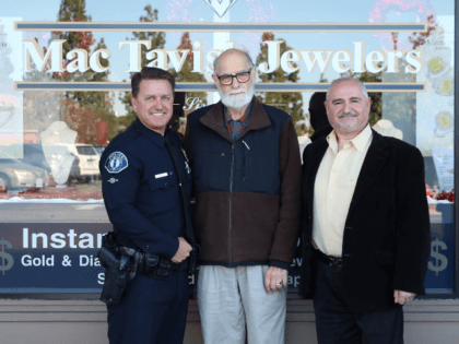 Officer Smith, David, and Harry in front of MacTavish Jewelers.