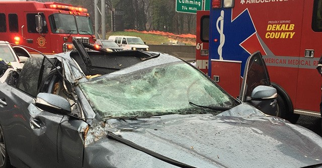 VIDEO: Tree Falls on Car on I-285; Driver Unharmed