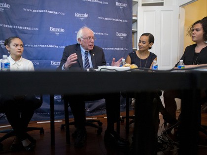 FILE - In this Dec. 7, 2015, file photo, Democratic presidential candidate, Sen. Bernie Sanders, I-Vt., center, discusses his "Family First" immigration plan, during a live broadcast from his campaign office in Washington. Joining Sanders are from left to right, Santos Guevara Amaya, who immigrated from El Salvador; Erika Andiola, …