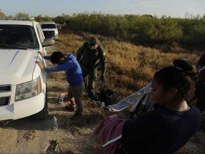Border Patrol agents holds a group thought to have entered the country illegally, near McAllen, Texas, along the U.S.-Mexico border. In the Rio Grande Valley. (AP Photo/Eric Gay)