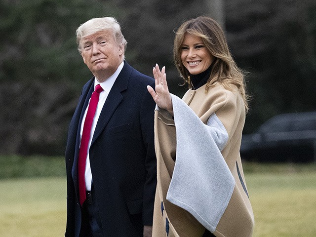 President Donald Trump, accompanied by a waving first lady Melania Trump, walks on the South Lawn as they depart the White House, Friday, Jan. 31, 2020, in Washington. Trump is en route to his Mar-a-Lago resort in Palm Beach, Fla. (AP Photo/Alex Brandon)