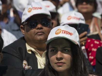 Spectators wear Trump hats as President Donald Trump and Indian Prime Minister Narendra Mo