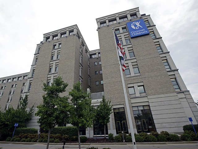 This Thursday, Sept. 12, 2013, photo shows the Children's Hospital Medical Center, in Cincinnati. The Medical center says it can't accept federal money to help sign people up for insurance under President Barack Obama's health care law because of new state restrictions. (AP Photo/Al Behrman)