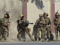An Afghan security personnel take position after gunmen disguised as policemen stormed a television station in Kabul on November 7, 2017. Gunmen disguised as policemen stormed a television station in Kabul on November 7, killing at least two people and wounding several others in the latest deadly attack on Afghan …