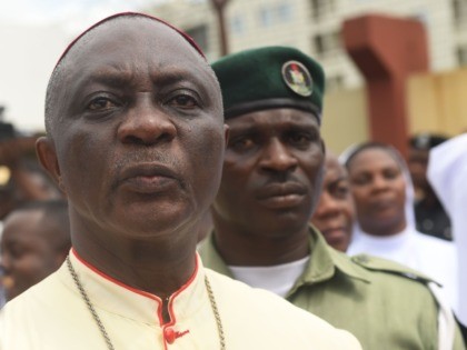 Catholic Archbishop of Lagos Alfred Adewale Martins looks on as policemen install a barrie
