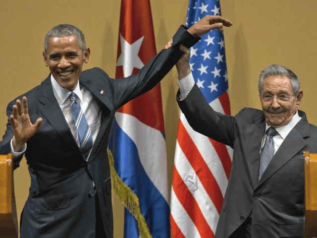 In this March 21, 2016 file photo, Cuban President Raul Castro, right, lifts up the arm of U.S. President Barack Obama, at the conclusion of their joint news conference at the Palace of the Revolution, in Havana, Cuba. The United States will vote this week against an annual United Nations resolution condemning the U.S. embargo on Cuba, reversing the Obama administration’s abstention last year. (AP Photo/Ramon Espinosa, File)