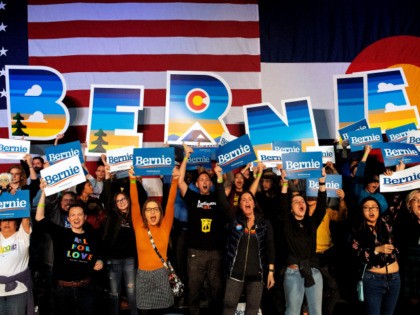 Supporters of Democratic presidential candidate Vermont Senator Bernie Sanders cheer durin