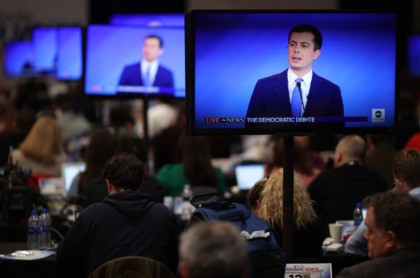 MANCHESTER, NEW HAMPSHIRE - FEBRUARY 07: Journalists watch from the press filing center as Democratic presidential candidates participate in a Democratic presidential primary debate in the Sullivan Arena at St. Anselm College on February 07, 2020 in Manchester, New Hampshire. Seven candidates qualified for the second Democratic presidential primary debate …