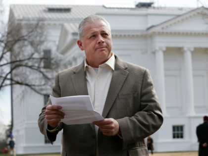 Republican candidate for Virginia governor, Denver Riggleman, reads from a statement during a news conference at the Capitol in Richmond, Va., Tuesday, Jan. 31, 2017. Riggleman addressed the killing of bill that would bar political contributions from regulated monopolies. (AP Photo/Steve Helber)