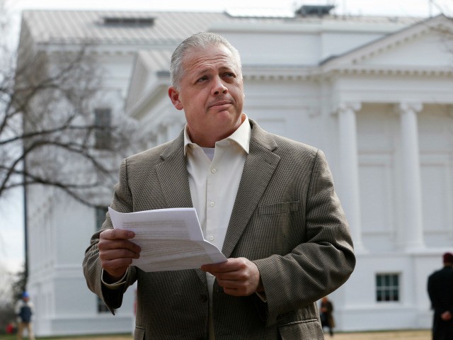 Republican candidate for Virginia governor, Denver Riggleman, reads from a statement durin