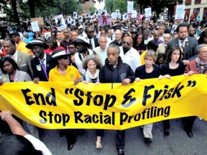 In this June 17, 2012, file photo, the Rev. Al Sharpton, center, walks with demonstrators during a silent march to end New York’s “stop-and-frisk” program. (AP Photo/Seth Wenig, File)