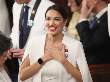 WASHINGTON, DC - FEBRUARY 05: U.S. Rep. Alexandria Ocasio-Cortez (D-NY) greets fellow lawm