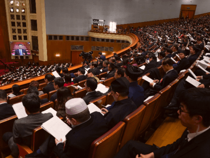 Deputies of the National People's Congress (NPC) listen to President of the Supreme People's Court Zhou Qiang's speech on the work of the Supreme People's Court during the third plenary meeting of the NPC at The Great Hall Of The People on March 12, 2019 in Beijing, China. (Photo by …