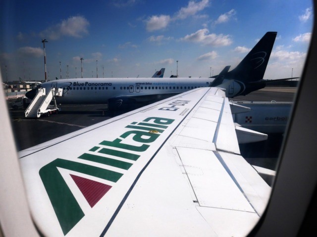The logo of Italy's flag carrier Alitalia is pictured on the wing of an Airbus A320 o