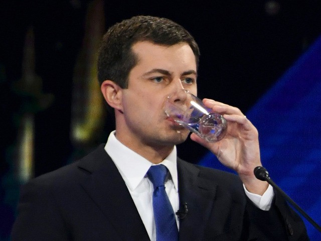 Democratic presidential hopeful Vermont Senator Bernie Sanders (R) speaks to Mayor of South Bend, Indiana, Pete Buttigieg as he drinks water during a break in the third Democratic primary debate of the 2020 presidential campaign season hosted by ABC News in partnership with Univision at Texas Southern University in Houston, …