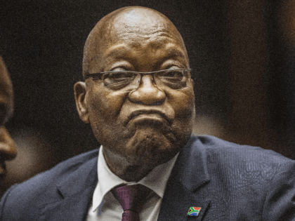 South Africa's embattled former president Jacob Zuma (C) in the Pietermaritzburg High Court where he is appearing on corruption charges, in what would be the first time he faces trial for graft despite multiple accusations, in Pietermaritzburg on October 15, 2019. - Zuma stands accused of taking kickbacks before he …